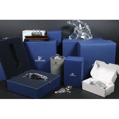 82 - Collection of Swarovski crystal ornaments, to comprise Swarovski Collectors Society examples, Tulips... 