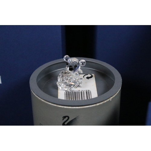 82 - Collection of Swarovski crystal ornaments, to comprise Swarovski Collectors Society examples, Tulips... 