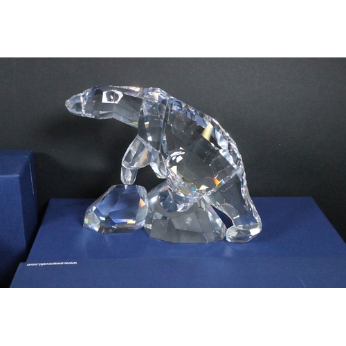 82 - Collection of Swarovski crystal ornaments, to comprise Swarovski Collectors Society examples, Tulips... 