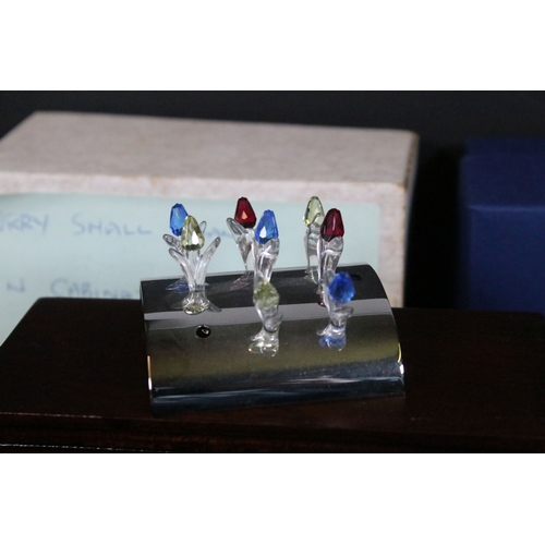 82 - Collection of Swarovski crystal ornaments, to comprise Swarovski Collectors Society examples, Tulips... 