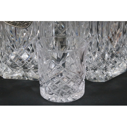 84 - Group of cut and moulded glass, to comprise primarily decanters, three of facetted square form, two ... 