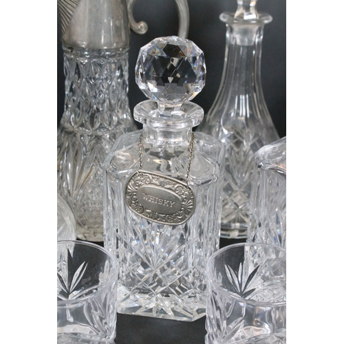 84 - Group of cut and moulded glass, to comprise primarily decanters, three of facetted square form, two ... 