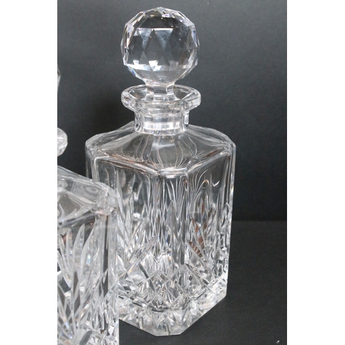 84 - Group of cut and moulded glass, to comprise primarily decanters, three of facetted square form, two ... 