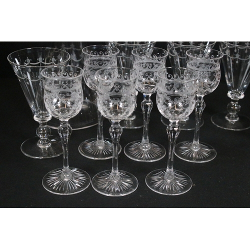 87 - Collection of engraved glassware, to include four wine glasses, six liqueur glasses and one decanter... 