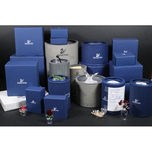 89 - Twenty-six boxed Swarovski crystal glass ornaments, to include 'Kim Tulip', 'Dino the Dinosaur', 'Ra... 