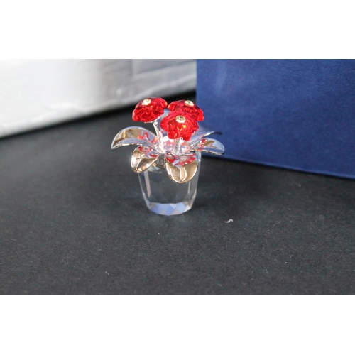 89 - Twenty-six boxed Swarovski crystal glass ornaments, to include 'Kim Tulip', 'Dino the Dinosaur', 'Ra... 