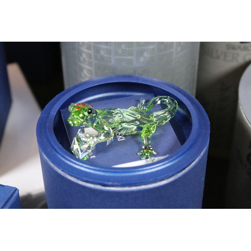 89 - Twenty-six boxed Swarovski crystal glass ornaments, to include 'Kim Tulip', 'Dino the Dinosaur', 'Ra... 
