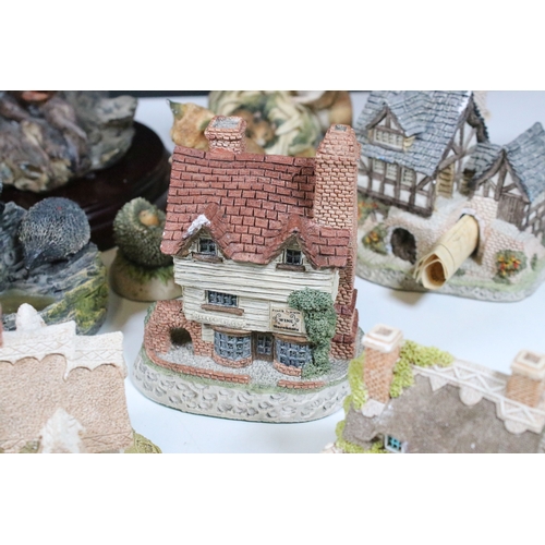 91 - Group of Lilliput Lane and David Winter cottages, to include The Bakehouse, mother's Cottage, etc., ... 