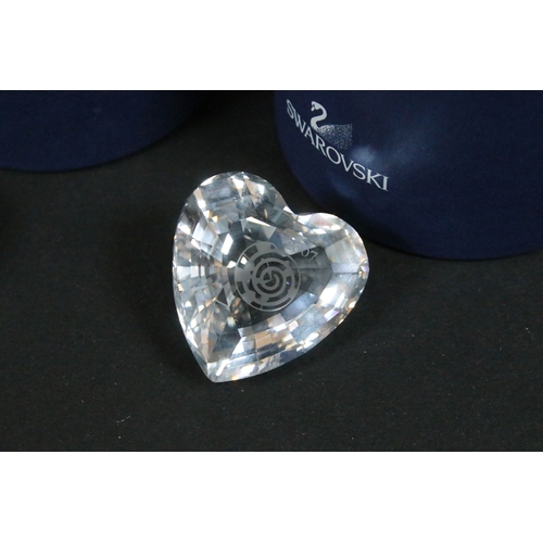92 - Collection of Swarovski crystal, comprising primarily commemoratives and paperweights, including hea... 