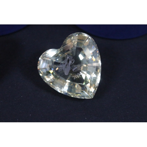 92 - Collection of Swarovski crystal, comprising primarily commemoratives and paperweights, including hea... 