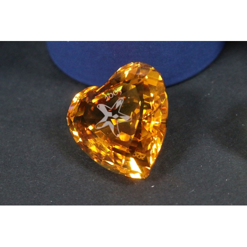 92 - Collection of Swarovski crystal, comprising primarily commemoratives and paperweights, including hea... 