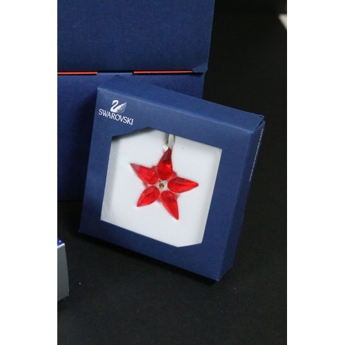 92 - Collection of Swarovski crystal, comprising primarily commemoratives and paperweights, including hea... 