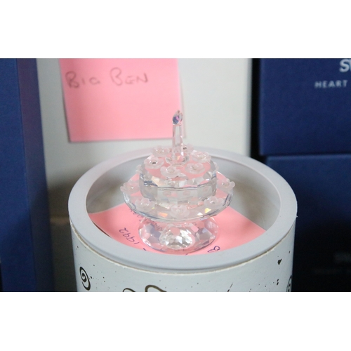 92 - Collection of Swarovski crystal, comprising primarily commemoratives and paperweights, including hea... 
