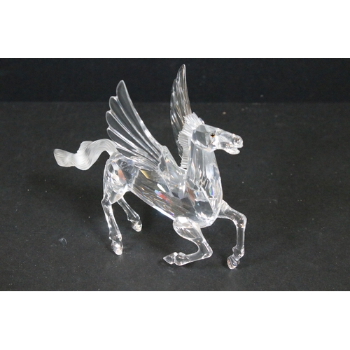 95 - Four boxed Swarovski Crystal Society ornaments, to include 'The Pegasus' 216327 and 'The Unicorn' 19... 