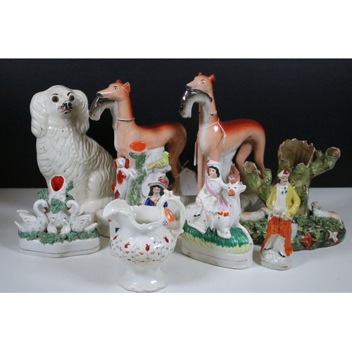 99 - Group of 19th century Staffordshire pottery, to include Scottish dancers, pair of Greyhound figures ... 