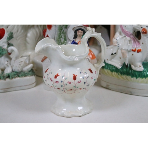 99 - Group of 19th century Staffordshire pottery, to include Scottish dancers, pair of Greyhound figures ... 