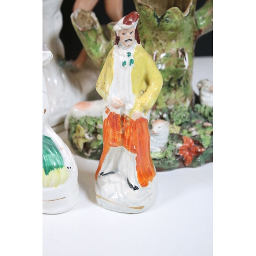 99 - Group of 19th century Staffordshire pottery, to include Scottish dancers, pair of Greyhound figures ... 