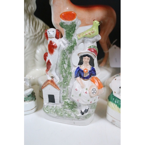99 - Group of 19th century Staffordshire pottery, to include Scottish dancers, pair of Greyhound figures ... 