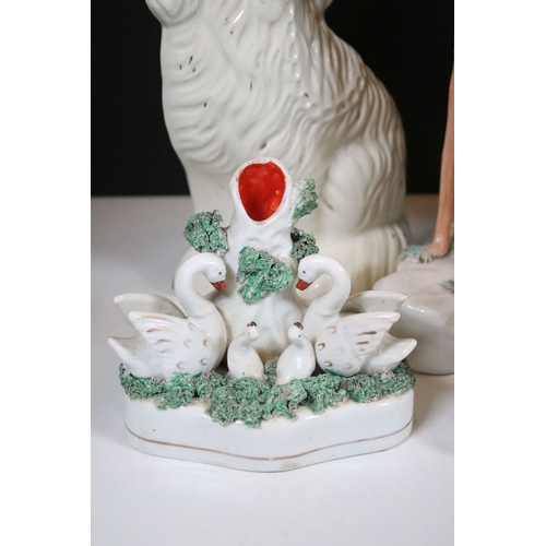 99 - Group of 19th century Staffordshire pottery, to include Scottish dancers, pair of Greyhound figures ... 