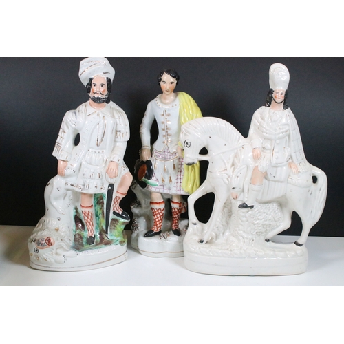 101 - Collection of eight Staffordshire figures, to include The Lion Slayer, Dick Turpin, Tom King. Talles... 