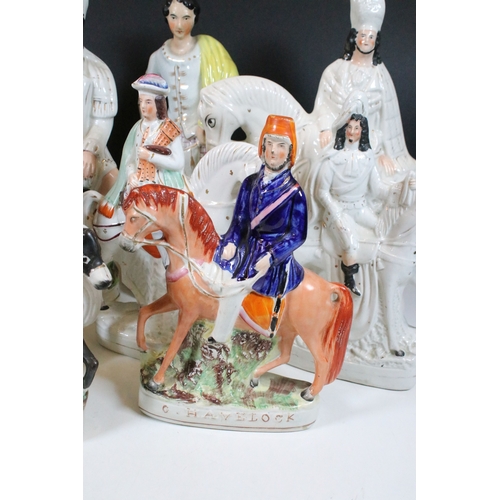 101 - Collection of eight Staffordshire figures, to include The Lion Slayer, Dick Turpin, Tom King. Talles... 