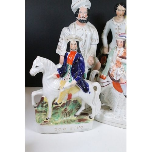 101 - Collection of eight Staffordshire figures, to include The Lion Slayer, Dick Turpin, Tom King. Talles... 
