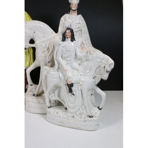 101 - Collection of eight Staffordshire figures, to include The Lion Slayer, Dick Turpin, Tom King. Talles... 