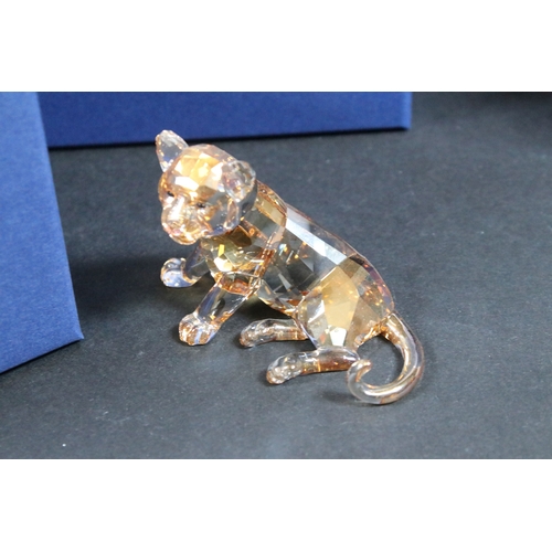 106 - Eleven boxed Swarovski crystal glass ornaments, to include Tiger Cub (originally only available to S... 