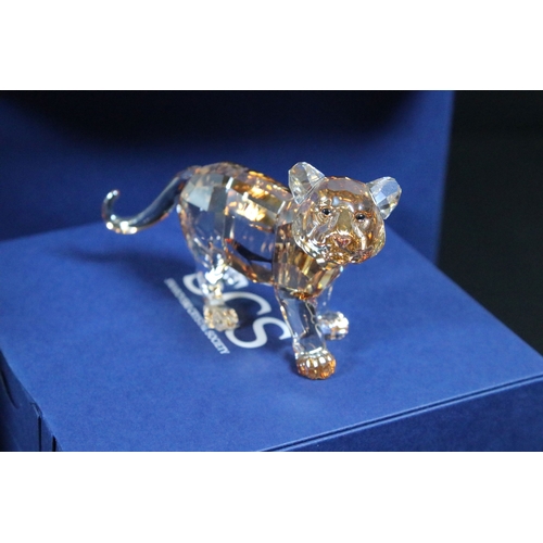 106 - Eleven boxed Swarovski crystal glass ornaments, to include Tiger Cub (originally only available to S... 