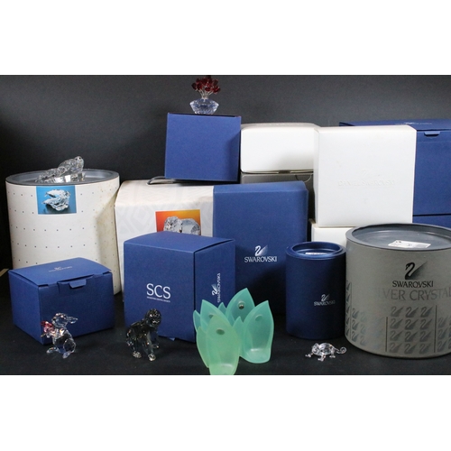 112 - Twenty-one boxed Swarovski crystal glass ornaments, to include a selection of 925 Sterling Silver go... 