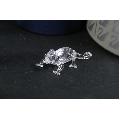 112 - Twenty-one boxed Swarovski crystal glass ornaments, to include a selection of 925 Sterling Silver go... 