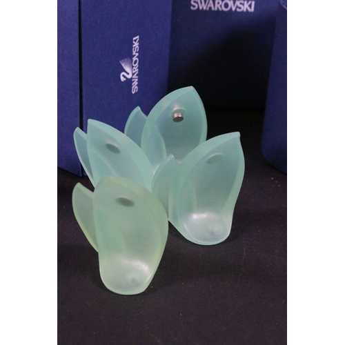 112 - Twenty-one boxed Swarovski crystal glass ornaments, to include a selection of 925 Sterling Silver go... 