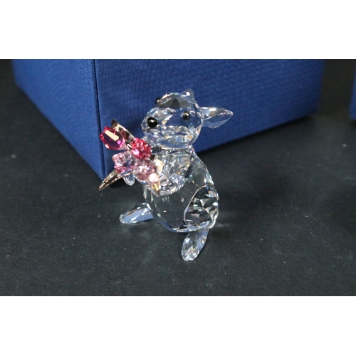 112 - Twenty-one boxed Swarovski crystal glass ornaments, to include a selection of 925 Sterling Silver go... 