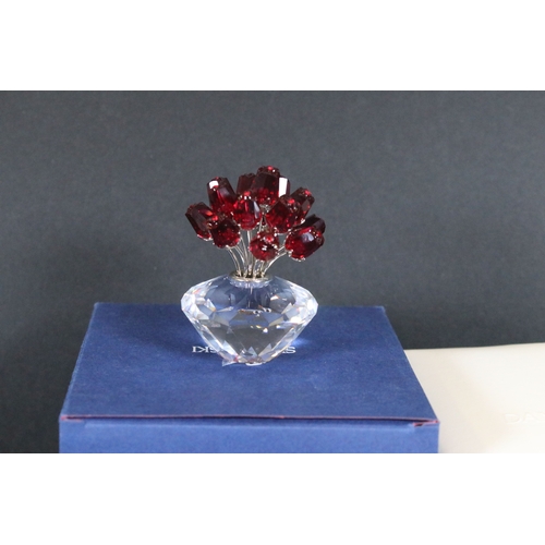 112 - Twenty-one boxed Swarovski crystal glass ornaments, to include a selection of 925 Sterling Silver go... 