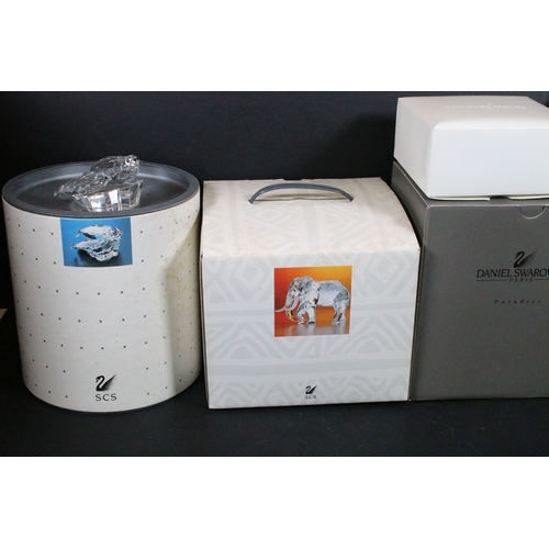 112 - Twenty-one boxed Swarovski crystal glass ornaments, to include a selection of 925 Sterling Silver go... 