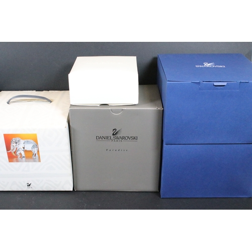 112 - Twenty-one boxed Swarovski crystal glass ornaments, to include a selection of 925 Sterling Silver go... 