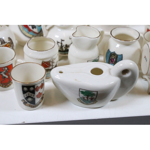 113 - Collection of Goss crested china, to include lighthouses, vases and pin dishes. Tallest measures 14.... 