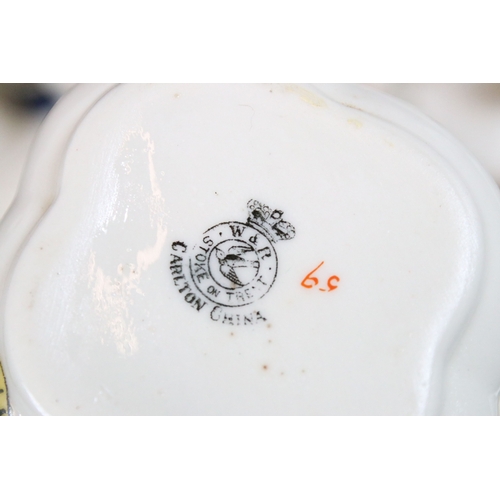 113 - Collection of Goss crested china, to include lighthouses, vases and pin dishes. Tallest measures 14.... 