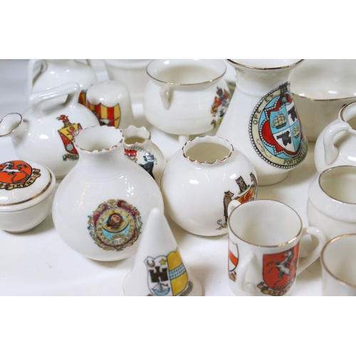 113 - Collection of Goss crested china, to include lighthouses, vases and pin dishes. Tallest measures 14.... 