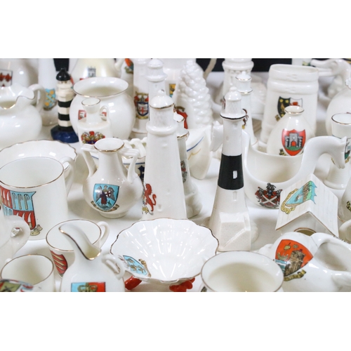 113 - Collection of Goss crested china, to include lighthouses, vases and pin dishes. Tallest measures 14.... 