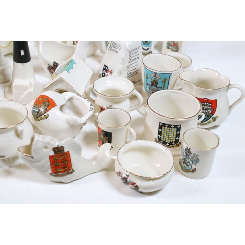 113 - Collection of Goss crested china, to include lighthouses, vases and pin dishes. Tallest measures 14.... 