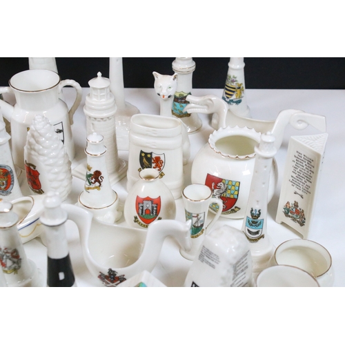 113 - Collection of Goss crested china, to include lighthouses, vases and pin dishes. Tallest measures 14.... 