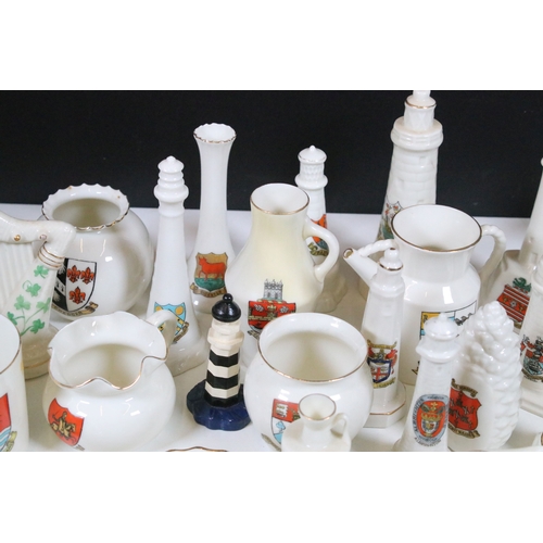 113 - Collection of Goss crested china, to include lighthouses, vases and pin dishes. Tallest measures 14.... 