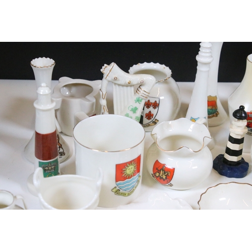 113 - Collection of Goss crested china, to include lighthouses, vases and pin dishes. Tallest measures 14.... 