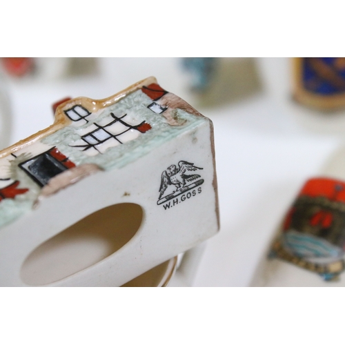114 - Assortment of mixed ceramics, to include fifty-two Goss crested china souvenirs, one Bristol semi po... 