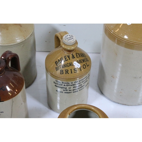 423 - Group of eight stoneware bottles and jars, to comprise examples for 'Pickup Bristol' and 'Powell Bri... 