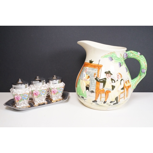 62 - Crown Devon Fieldings musical jug, moulded in relief with an interior scene, with Auld Lang Syne poe... 