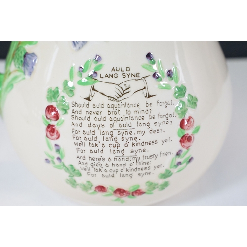 62 - Crown Devon Fieldings musical jug, moulded in relief with an interior scene, with Auld Lang Syne poe... 