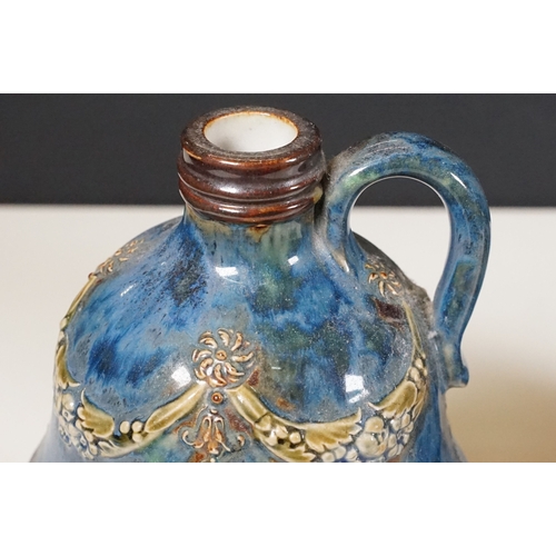 64 - Pair of Royal Doulton stoneware whisky decanters with loop handles, marked to base No. 8895, measure... 