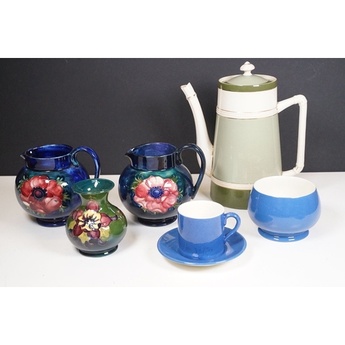 65 - Collection of Moorcroft ceramics to include 2 x Anemone jugs on blue ground (One William Moorcroft e... 